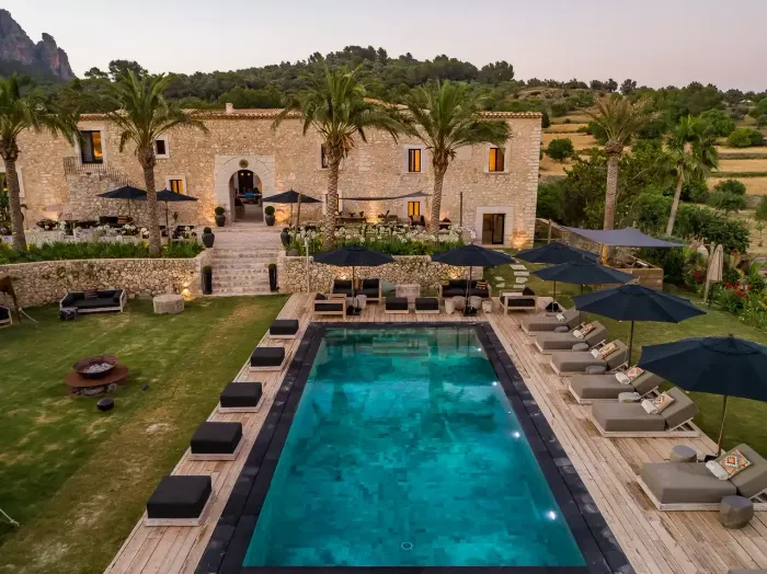 Luxury estate Spirit of Son Fuster in Alaró Mallorca with private pool, palm trees and mountain backdrop